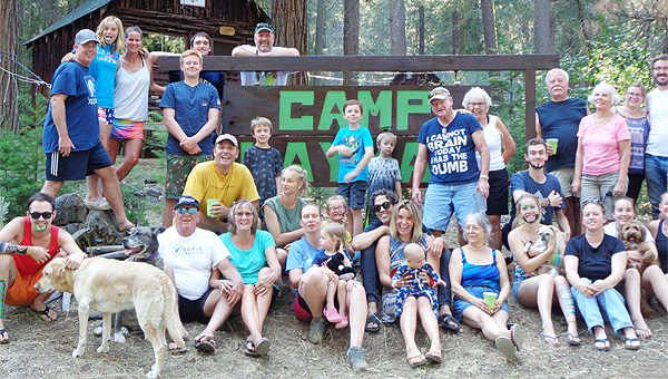 Guests and Camp Layman sign